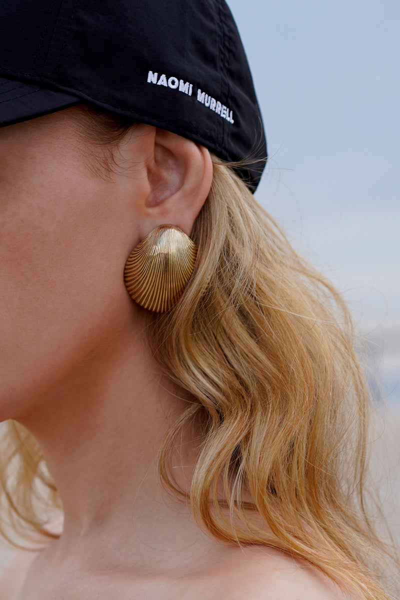 Super Shell Earrings, Worn Side View with Cap