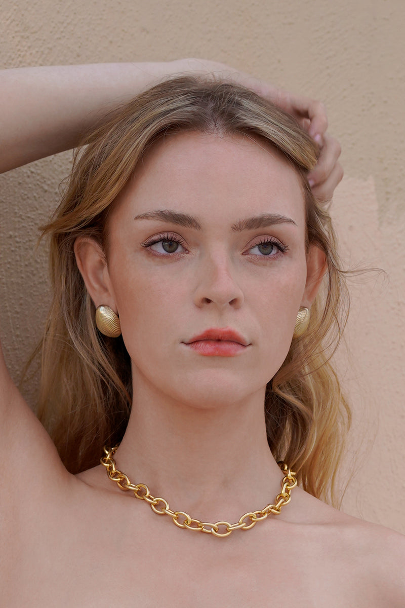 Shell Earring in Golden Brass, Worn Front View